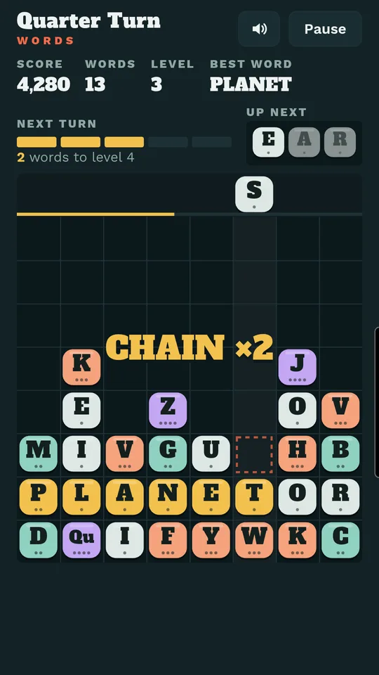 A word, PLANET, flashing gold as it clears, with a CHAIN ×2 bonus